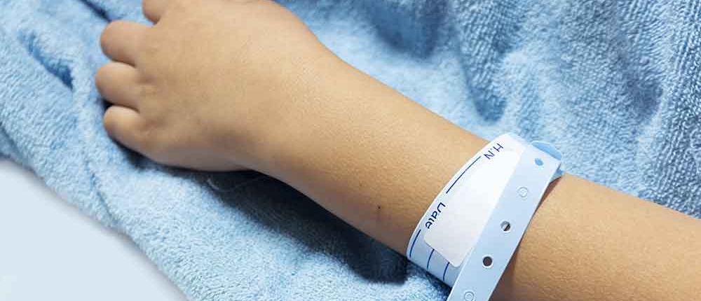 A hospital patient wearing an identification bracelet