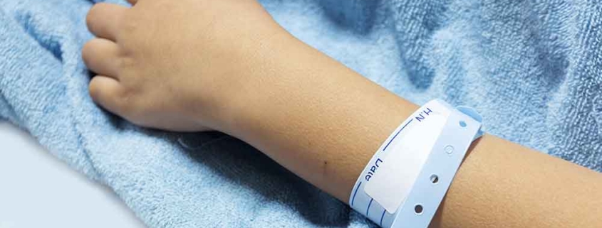 A hospital patient wearing an identification bracelet